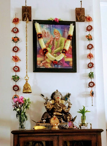 Lord Ganesh seated on a chowki