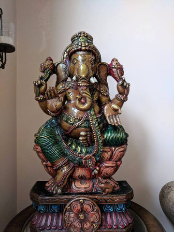 Lord Ganesh seated on  Lotus - South Indian wood sculpture