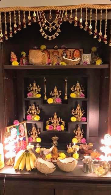 Ashtalakshmi in wooden frame.