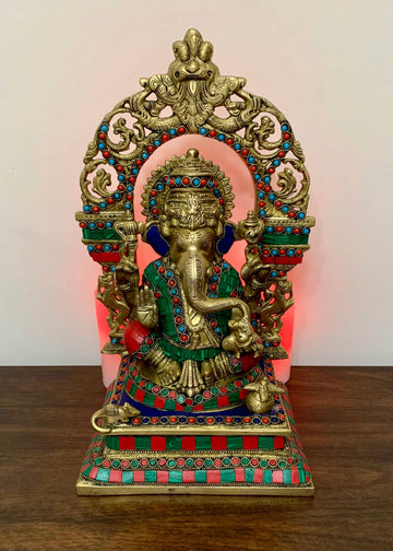 Lord Ganesh sitting on a Kirtimukha Throne
