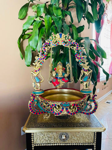 Jhoola Ganesh Urli - Lord Ganesha on a swing with a Urli
