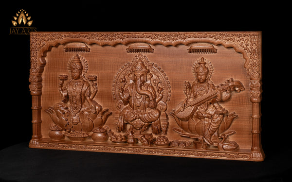The Divine Trinities 14" x 28" Lord Ganesh, Goddess Lakshmi and Goddess Saraswathi Wood Carving
