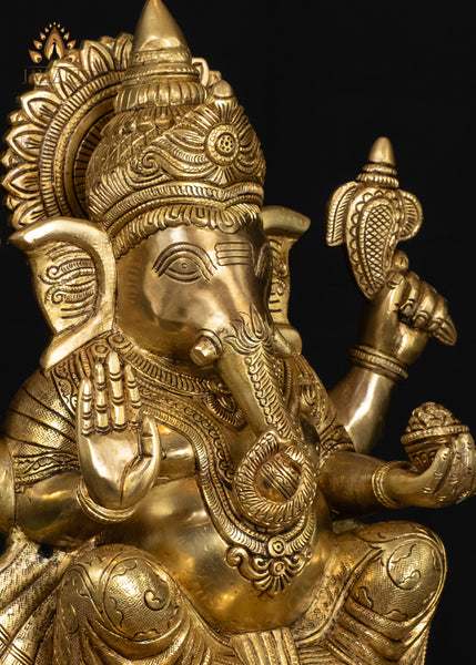 19" Brass Ganesha Seated On A Detailed Base With Sacred Symbols