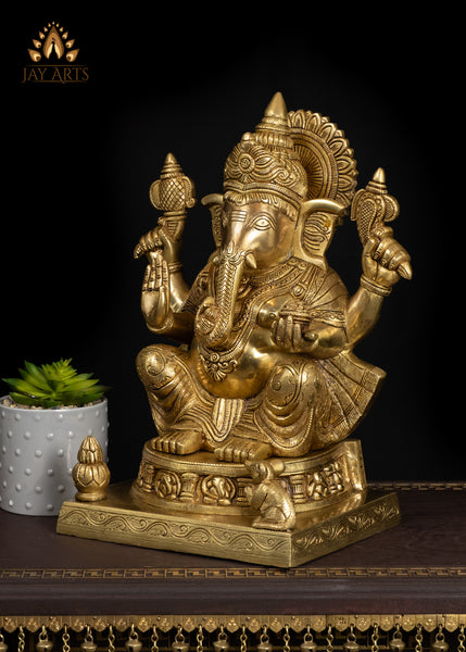 19" Brass Ganesha Seated On A Detailed Base With Sacred Symbols