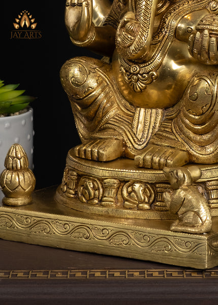 19" Brass Ganesha Seated On A Detailed Base With Sacred Symbols