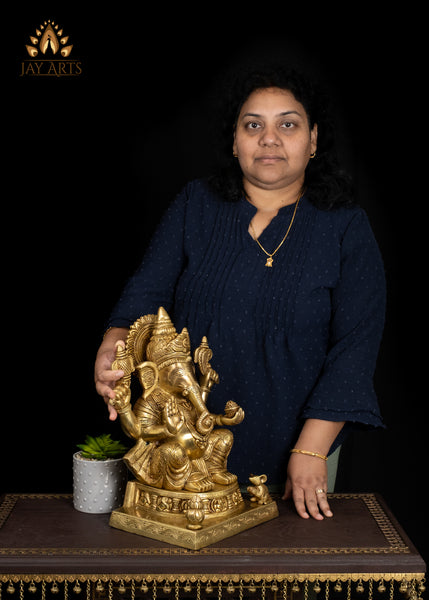 19" Brass Ganesha Seated On A Detailed Base With Sacred Symbols