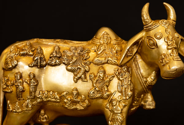 Cow and a Calf with Figurines of Gods and Goddesses