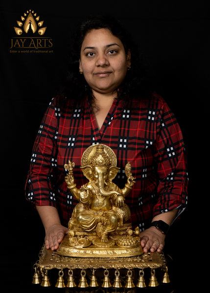 Lord Ganapathi seated with Modak