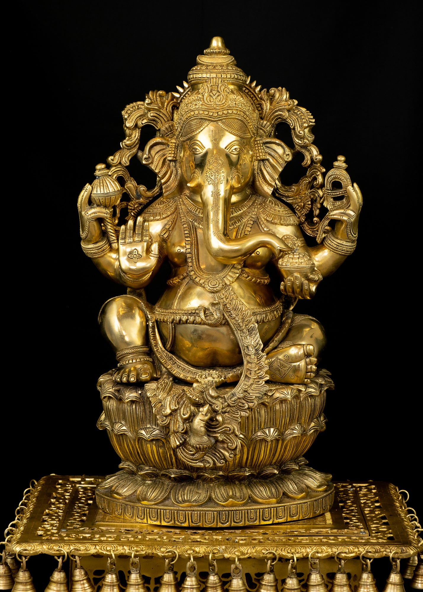 Raja Ganapathi seated on a raised Lotus Pedestal