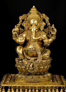 Raja Ganapathi seated on a raised Lotus Pedestal