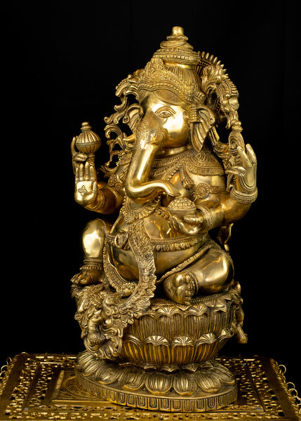 Raja Ganapathi seated on a raised Lotus Pedestal