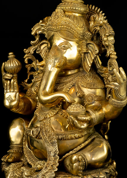 Raja Ganapathi seated on a raised Lotus Pedestal
