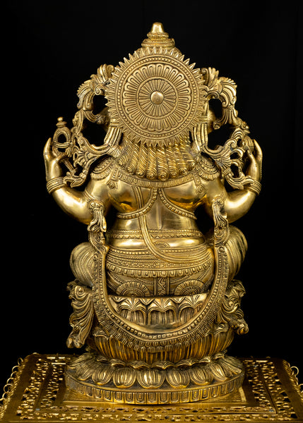 Raja Ganapathi seated on a raised Lotus Pedestal
