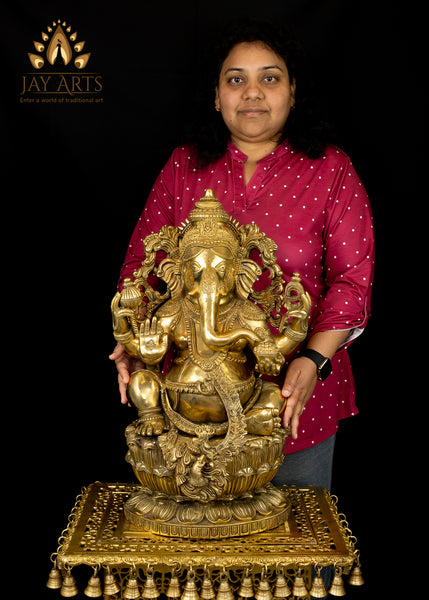 Raja Ganapathi seated on a raised Lotus Pedestal