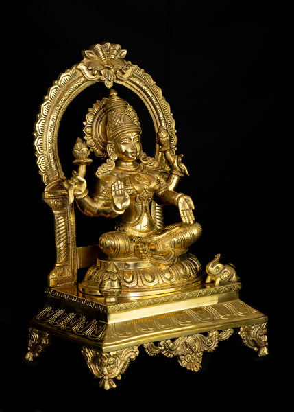 Goddess Mahalakshmi seated on a Kirtimukha Throne 17" Brass Statue