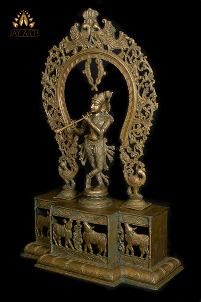 Bronze Sri Krishna Standing on a Cow Engraved Base with a Peacock Arch 44" - Lost-Wax Method Sculpture