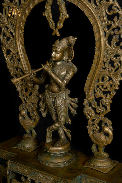 Bronze Sri Krishna Standing on a Cow Engraved Base with a Peacock Arch 44" - Lost-Wax Method Sculpture