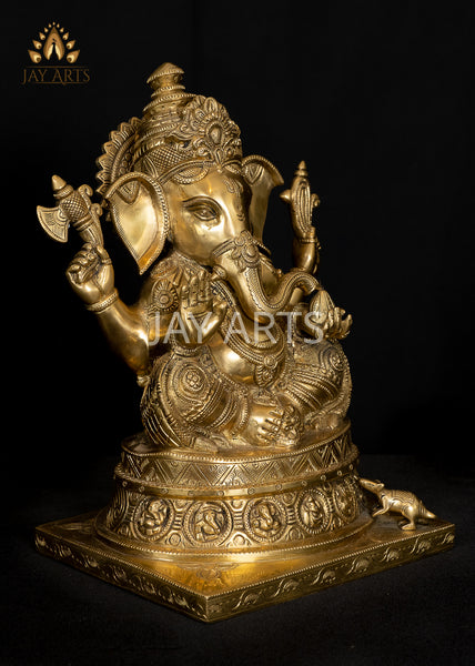 Ashirvadh Ganesh seated on a Pedestal Engraved with Figurines of Baby Ganeshas 13"