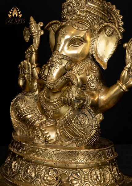 Ashirvadh Ganesh seated on a Pedestal Engraved with Figurines of Baby Ganeshas 13"