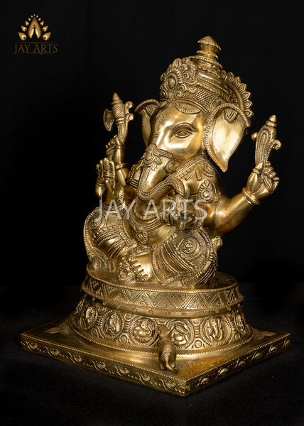 Ashirvadh Ganesh seated on a Pedestal Engraved with Figurines of Baby Ganeshas 13"