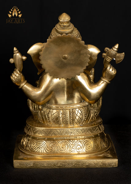 Ashirvadh Ganesh seated on a Pedestal Engraved with Figurines of Baby Ganeshas 13"