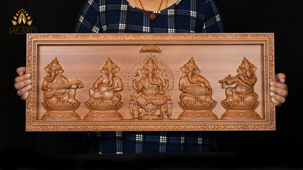 A Wood Carving of Lord Ganesh and The Musical Vignahartas 12" x 30"