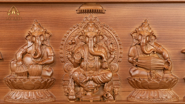 A Wood Carving of Lord Ganesh and The Musical Vignahartas 12" x 30"