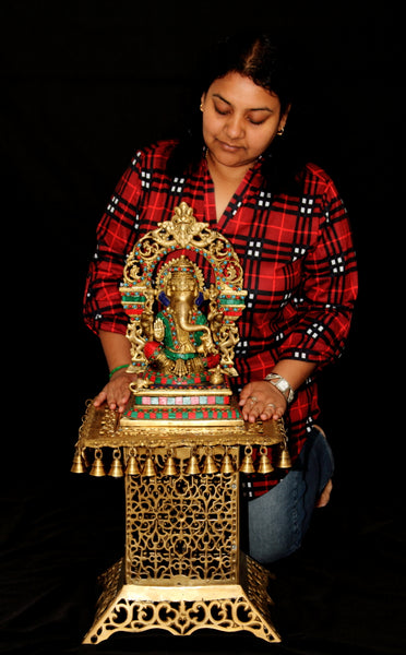 Lord Ganesh sitting on kirtimukha throne