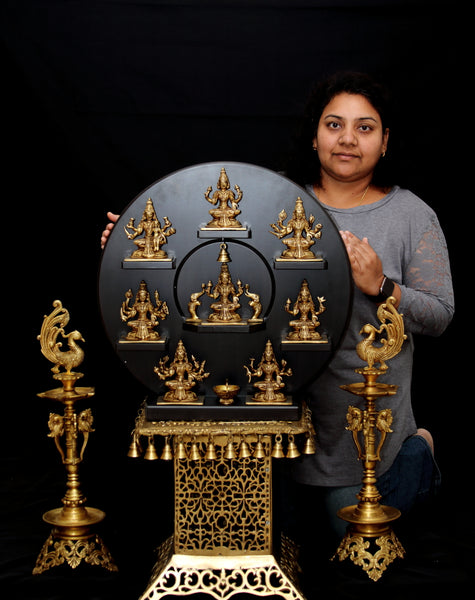 Ashta Lakshmi  in a circular wood frame