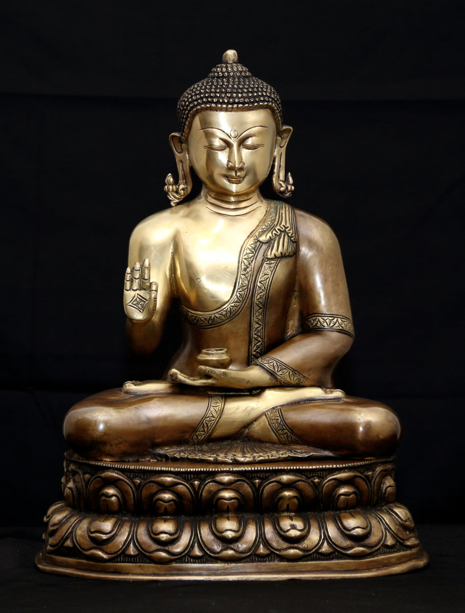 Buddha in Vitarka mudra seated on a double Lotus pedestal