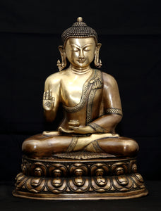 Buddha in Vitarka mudra seated on a double Lotus pedestal