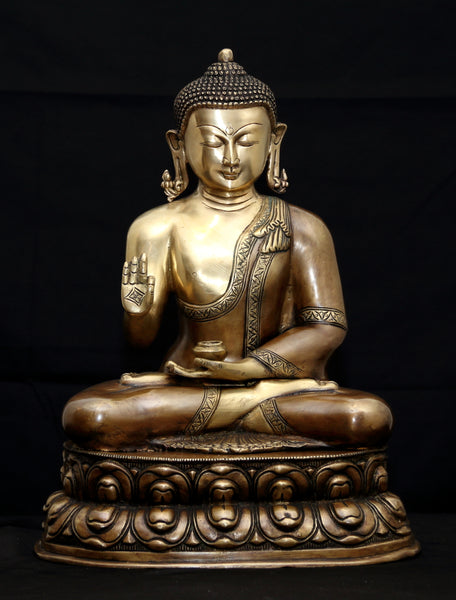 Buddha in Vitarka mudra seated on a double Lotus pedestal