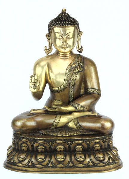 Buddha in Vitarka mudra seated on a double Lotus pedestal
