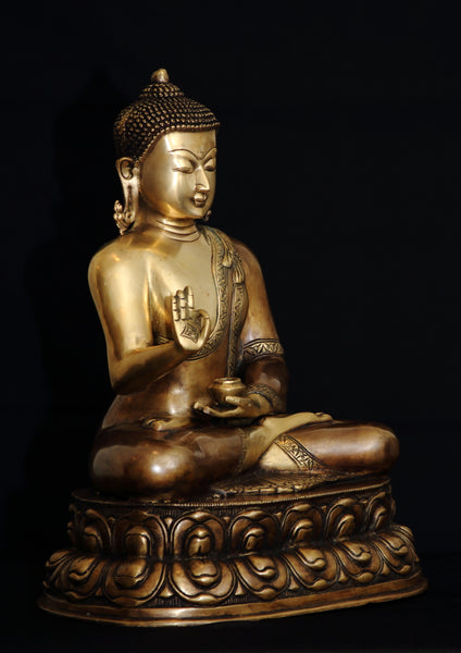 Buddha in Vitarka mudra seated on a double Lotus pedestal