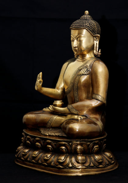 Buddha in Vitarka mudra seated on a double Lotus pedestal