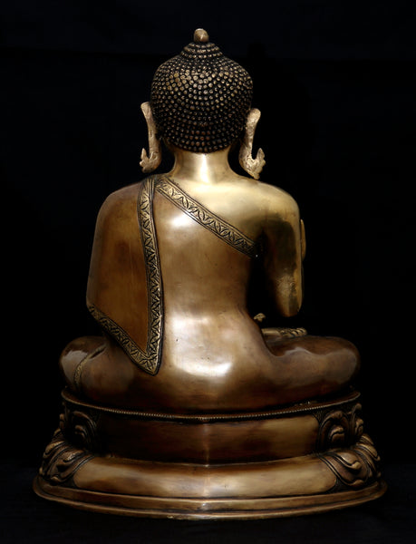 Buddha in Vitarka mudra seated on a double Lotus pedestal