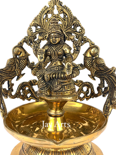 Goddess Lakshmi lamp with peacocks
